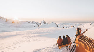 Group of people in the snow in Will & Bear beanies enjoying the mountain view