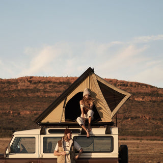 Relaxed outdoor scene with Will & Bear off white chunky knit beanie, perfect for camping trips