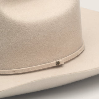 Close-up detail of the crown and brim stitching of the Will & Bear white cowboy hat felt.