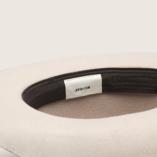 Interior sweatband and label of the Will & Bear white cowboy hat felt, showcasing construction quality and branding.