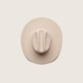 Top-down view of the Will & Bear white cowboy hat felt design, highlighting the cattleman-style crown.