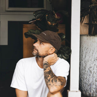Man wearing Will & Bear Brown 5 Panel Cap, casual and durable for everyday adventures