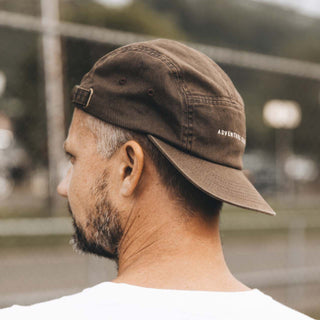 Side profile of man wearing Will & Bear Brown 5 Panel Cap, perfect for relaxed outdoor style