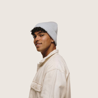 Man in profile view wearing the Will & Bear Bambi Dust Blue beanie, showcasing minimal design and wool warmth.