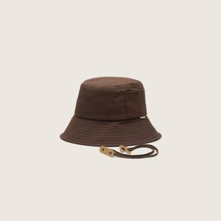 A Will & Bear removable string bucket hat in chocolate brown, displayed on a neutral background.