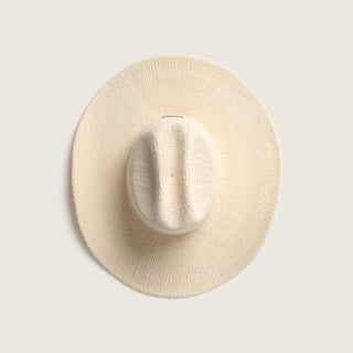 Top-down view of the Will & Bear white straw cowboy hat highlighting its structured crown and wide brim.