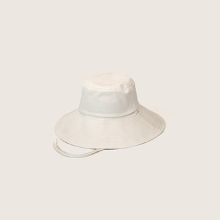 Will & Bear Kids Packable Bucket Hat in natural cotton shown on a neutral background with chin strap visible.