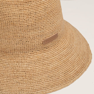 Close-up detail of Will & Bear Sunny Sand Crushable Straw Bucket Hat showing breathable raffia weave