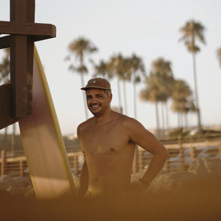 Man Wearing Will & Bear Ranger Brown Vintage 5-Panel Cap – Coastal Lifestyle in Classic Canvas Cap.