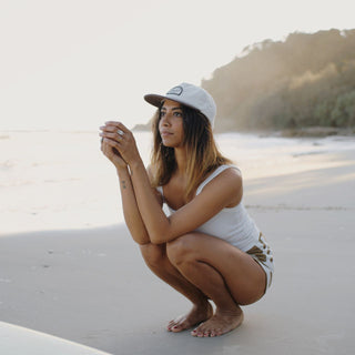 Woman Wearing Will & Bear Ranger Milo Vintage Corduroy Cap on the Beach – Lightweight Summer Cap.