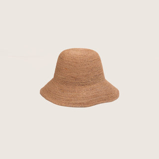 Will & Bear Women’s Straw Bucket Hat – Sunny Husk – angled view showcasing flexible natural fibre and gently curved brim, displayed on a neutral background.