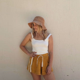 Casual outfit featuring Will & Bear Women’s Straw Bucket Hat – Sunny Husk – soft, natural straw texture for summer simplicity.