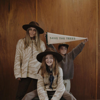 Will & Bear Woodley Auburn hats featured in family portrait – part of ‘This Hat Plants a Tree’ initiative.