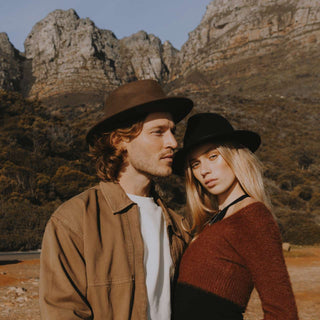 Couple wearing Will & Bear William Black and William Brown fedoras – wool travel hats styled for outdoor living.