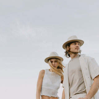 Couple outdoors wearing Will & Bear William Cream felt hats – lightweight, crushable travel hat for beach days and beyond.