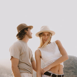 Couple in soft afternoon light wearing Will & Bear William Oak and William Cream felt hats – made for conscious adventurers.