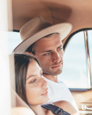 Intimate road trip moment featuring Will & Bear Felt Fedora Hats, blending outdoor spirit and adventure