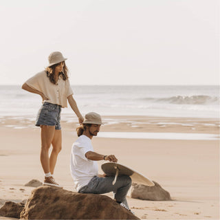Sunset Scene with Will & Bear Perry Bone Beige Cord Bucket Hat – Relaxed Coastal Moment.