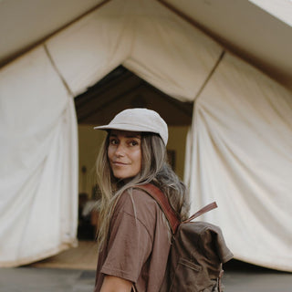 Woman Wearing Will & Bear Parker Bone Beige Cord Dad Cap – Travel-Ready Cap in Nature.