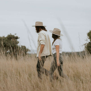 Couple Wearing Will & Bear Percy Eucalyptus Felt Western Hats – Adventure-Ready Headwear in Natural Surroundings.
