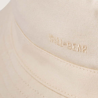 Close-up detail of the Will & Bear Fischer Bone White Bucket Hat showing logo embroidery and stitching.