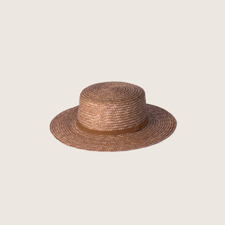 Will & Bear Harvey Amber Women’s Straw Boater on neutral background, featuring flat crown and wide woven brim.