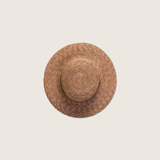 Top-down view of the Will & Bear Harvey Amber Women’s Straw Boater showing circular crown and natural straw texture.