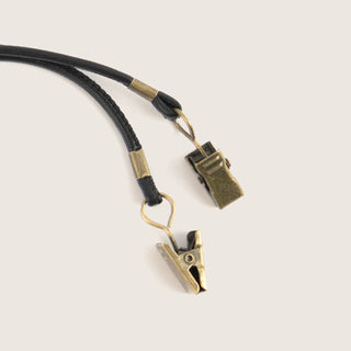 Close-up of Will & Bear Hat Carry Clips showing durable brass hardware and leather detail.