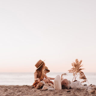 Two Children Wearing Will & Bear Kids Straw Hats – Little Harvey Amber on the Beach at Sunset.