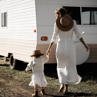 Woman and Child Wearing Will & Bear Straw Hats – Little Harvey Amber Kids Straw Hat Beside Caravan.