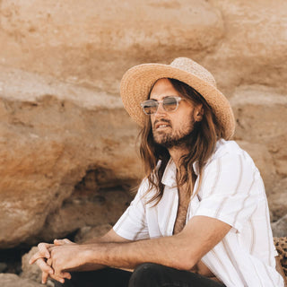 Man wearing Will & Bear Men's and Women's Straw Hat, ideal for long summer days outdoors