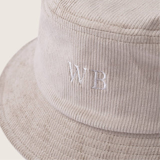 Detail of Embroidered WB Logo on Will & Bear Perry Bone Beige Cord Bucket Hat – Corduroy Texture Close-Up.