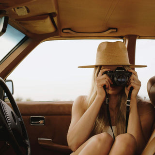 Woman wearing Will & Bear Wide Brim Straw Hat – Sawyer Sand – capturing the moment, designed for summer explorers.