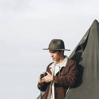 Man Wearing Will & Bear Woodley Moss Felt Gardening Hat – Sustainable Wool Hat for Outdoor Photography