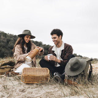 Couple Enjoying Picnic Wearing Will & Bear Woodley Moss Felt Gardening Hats – Sustainable Outdoor Headwear