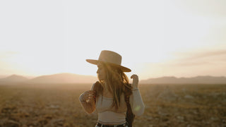 Women standing in the desert wearing a Will & Bear hat