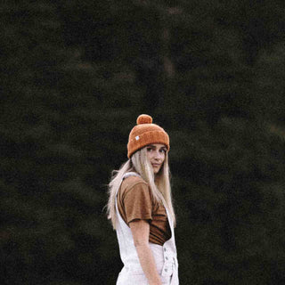 Woman wearing Australian wool beanie with pom pom