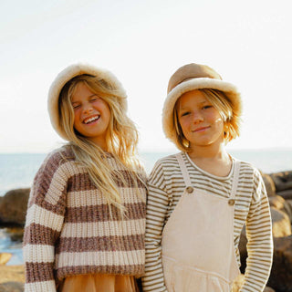 girl and boy wearing the ugg wool bucket hat