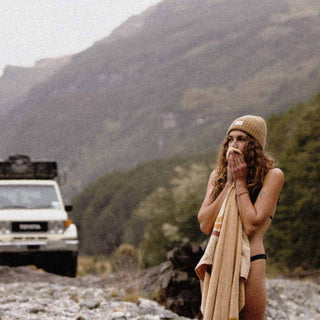 Woman with curly hair wearing Australian Wool beanie