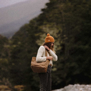 Woman carrying bag wearing Australian Wool Beanie