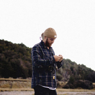 Man wearing brown wool beanie