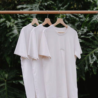 Recycled and organic cotton tees hanging