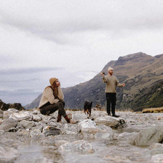 Man and woman fishing wearing wool beanies