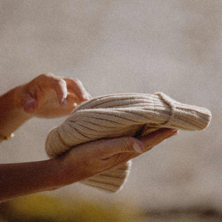 Woman holding Australian ribbed wool beanie