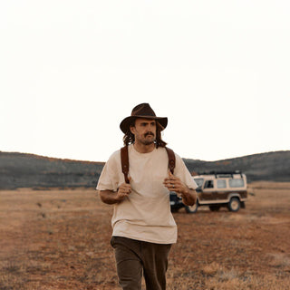 Man walking in Australian outback wearing Anderson Brown wide brim hat