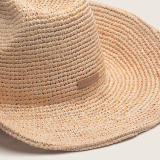 Crochet straw cowboy hat with a brand label
