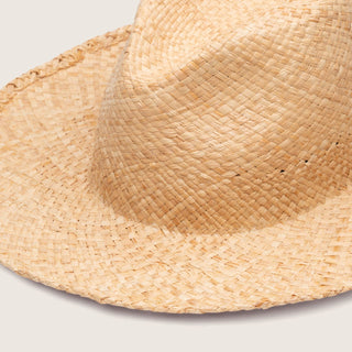 Close up studio shot of rustic straw beach hat Jude Sand by Will & Bear