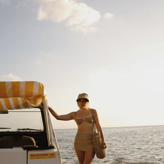 Side view of Ari Sand straw visor hat highlighting wide front brim