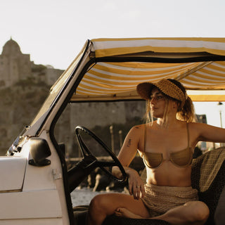 Ari Sand straw visor hat styled with a light summer outfit outdoors