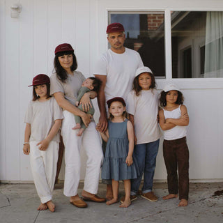 Family wearing the Archie MAroon Cap